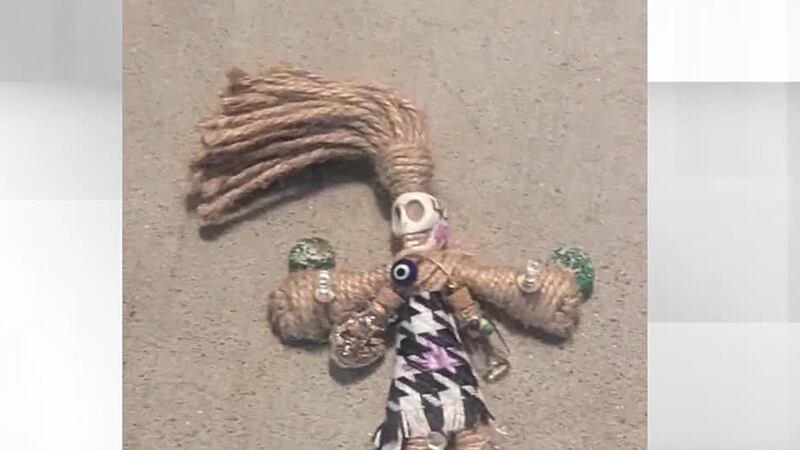 A family said they have suffered repeated attacks, including finding a voodoo doll on their...
