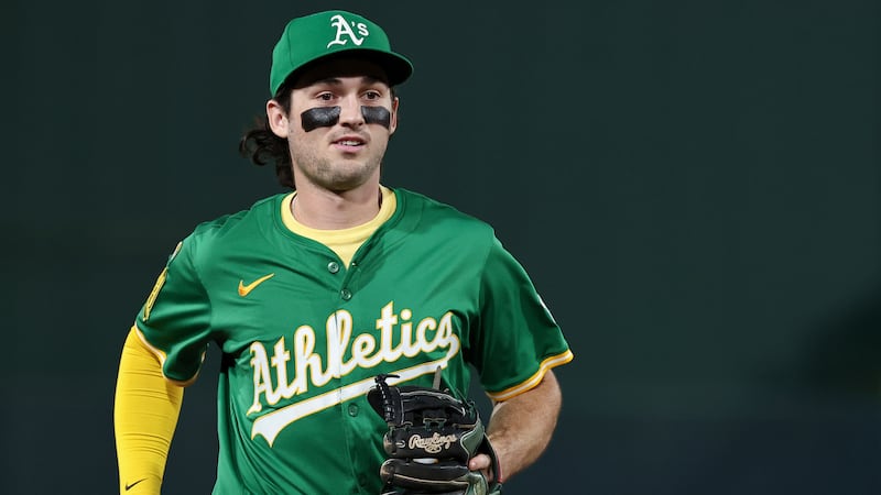 Athletics shortstop Jacob Wilson runs to the dugout during the ninth inning of a baseball game...