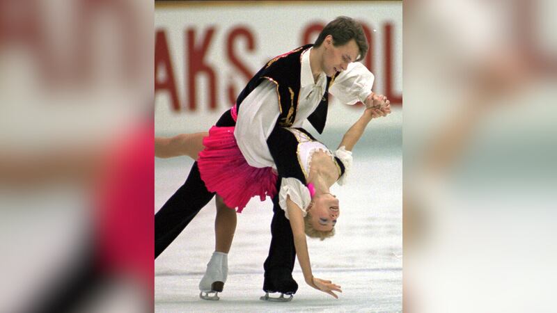 FILE - Evgenia Shishkova and Vadim Naumov of Russia perform during free skating in the pairs...