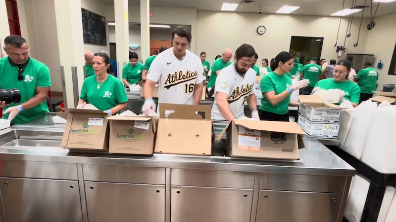Athletics players and staff volunteered at Three Square Food Bank on Tuesday, packing meals as...