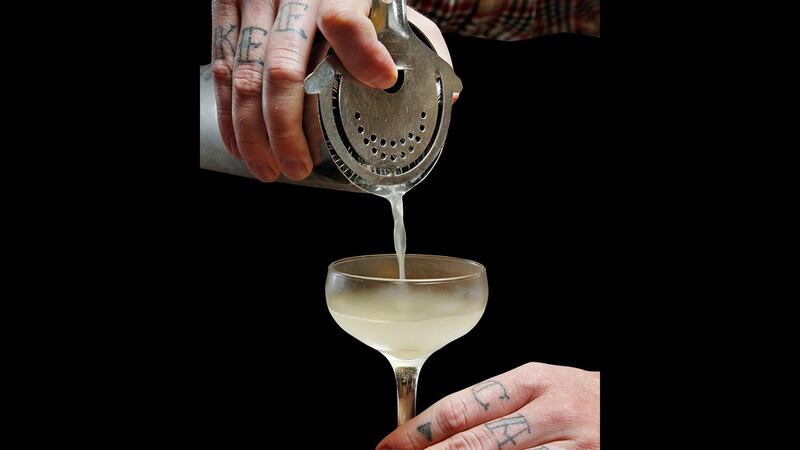 A cocktail is poured.