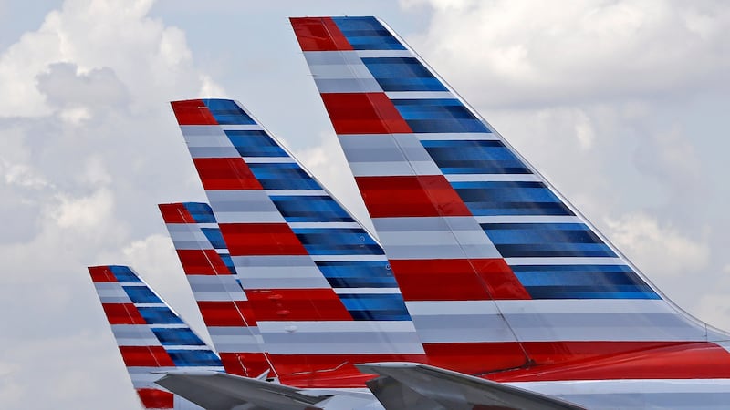 FILE - American Airlines passenger planes are parked at Miami International Airport, in Miami...