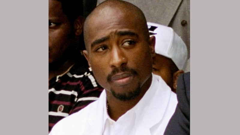 FILE - In this Aug. 15, 1996, file photo, rapper Tupac Shakur attends a voter registration...
