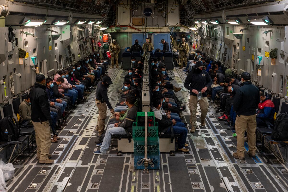 Illegal aliens await takeoff for a removal flight at the Tucson International Airport, Ariz.,...