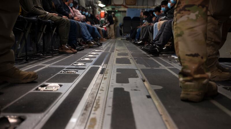 FILE Illegal aliens await takeoff in a A C-17 Globemaster III for a removal flight at the...