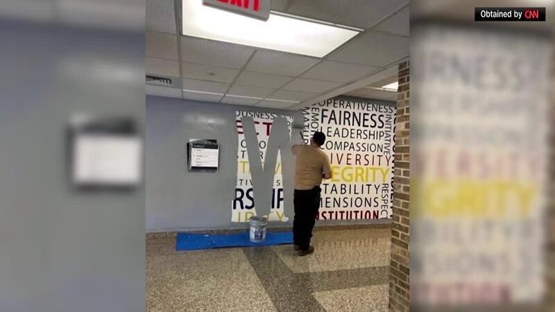 A photo shows the core values at the FBI Academy in Quantico, Virginia, being painted over