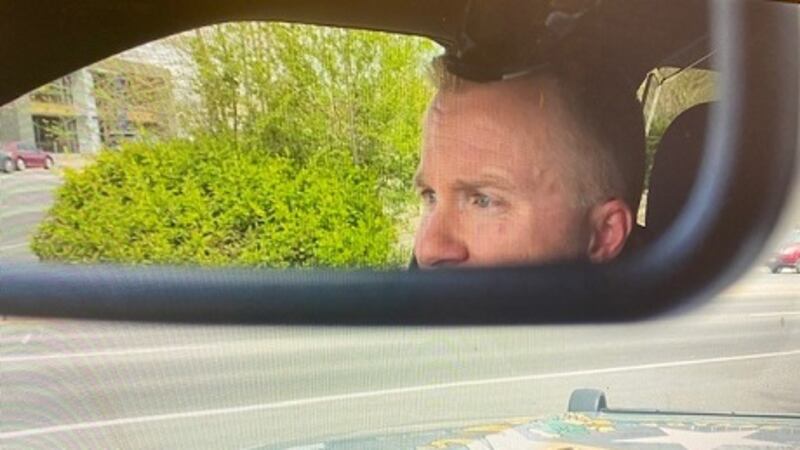 NHP Trooper Charles Caster watches traffic from his patrol car