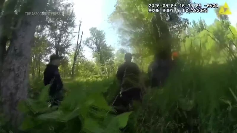 Body cam footage shows how rescue teams found 2 women and a boy who were stranded for three...