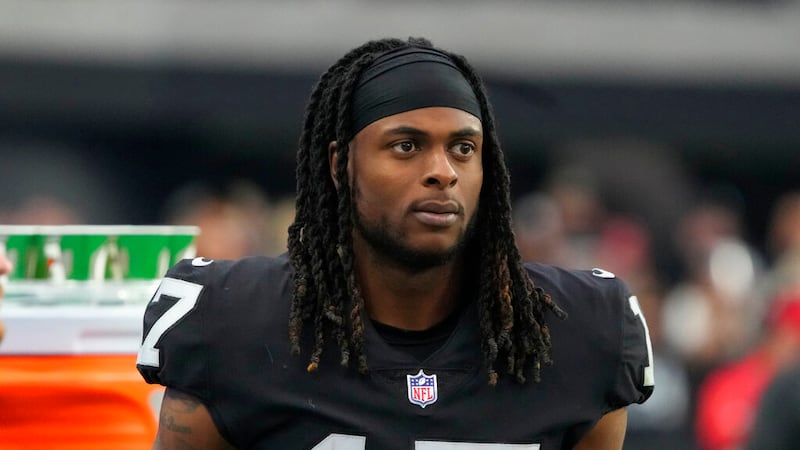 Las Vegas Raiders wide receiver Davante Adams (17) leaves the field after an NFL football game...
