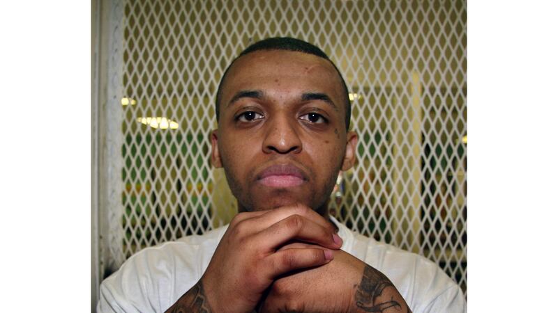 FILE - Texas death row inmate Steven Lawayne Nelson poses for a photo in a visiting cage at...