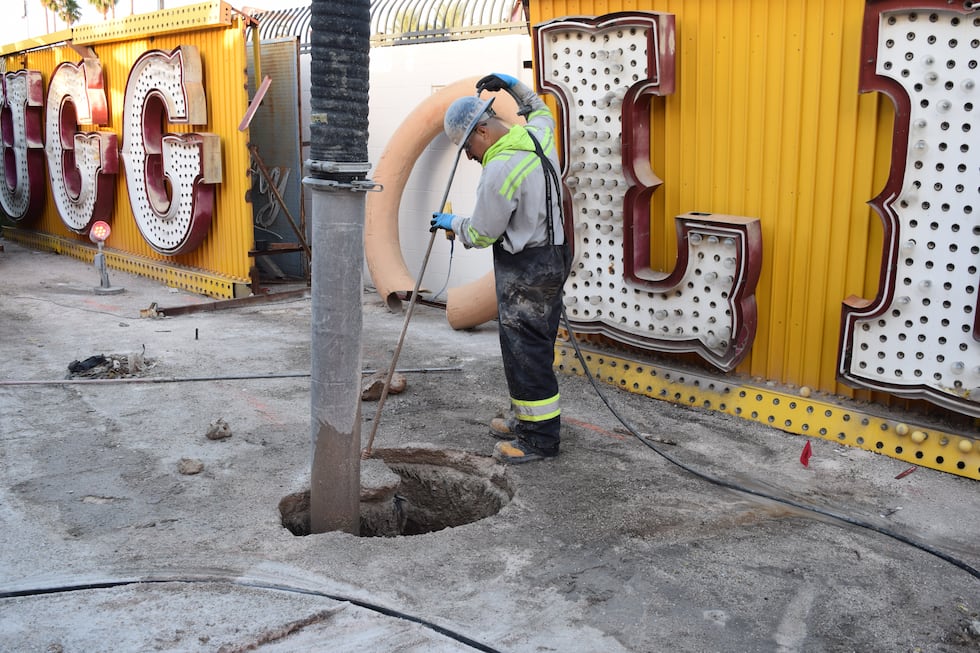 A workman prepares the pylon that will eventually hold the restored El Cortez sign.