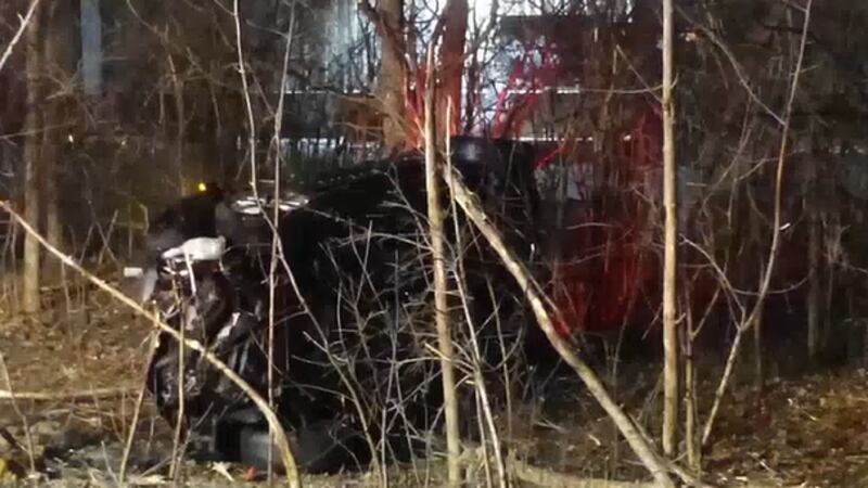 Police are recognizing a man who risked his life to help save two people from a burning car.