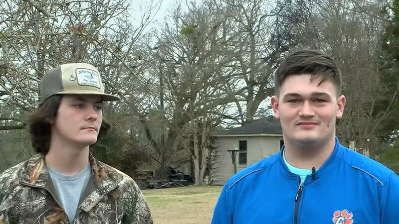 On their way to school, stepbrothers James Phillips and Colton Sanders noticed smoke coming...