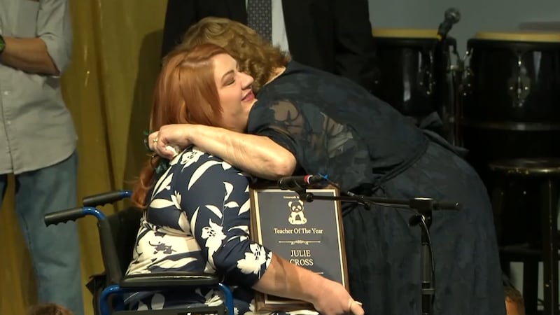 Julie Cross was surprised with Teacher of the Year honor at Crossroads Academy graduation...