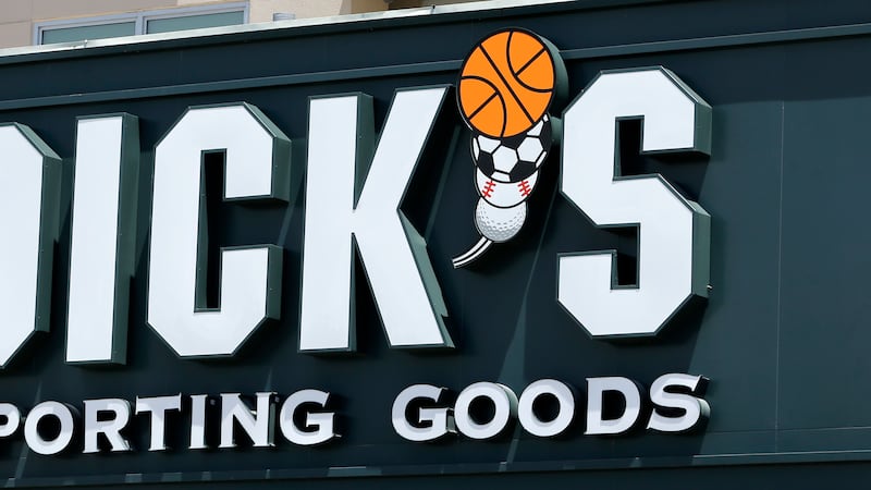 FILE -This photo taken Tuesday, Aug. 29, 2017, shows a Dick's Sporting Goods sign at a store...