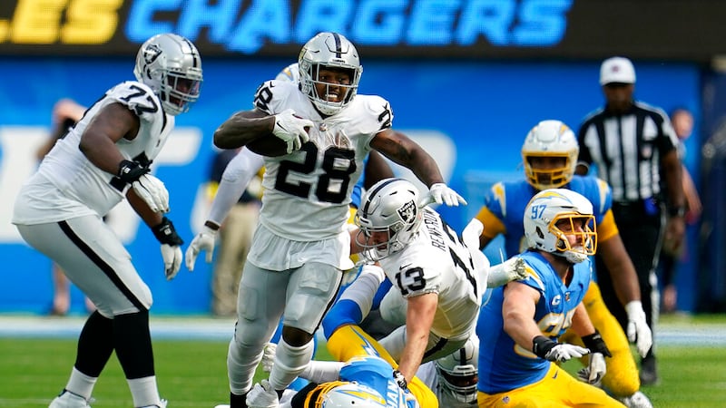 Las Vegas Raiders running back Josh Jacobs (28) runs against the Los Angeles Chargers during...