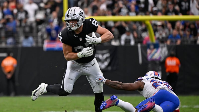 Las Vegas Raiders tight end Michael Mayer (87) makes a catch in front of Buffalo Bills safety...