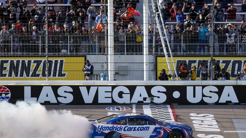 Kyle Larson (5) celebrates after winning a NASCAR Cup Series auto race at Las Vegas Motor...