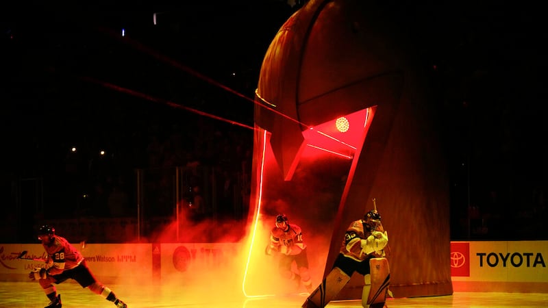 Vegas Golden Knights players William Carrier (28), left, Nicolas Roy (10), center and...