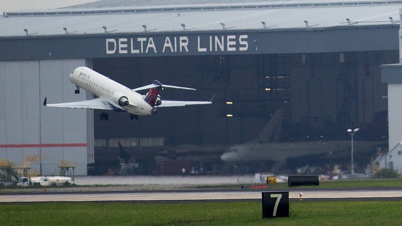 A Delta Air Lines plane takes off at Atlanta's Hartsfield International Airport in Atlanta in...