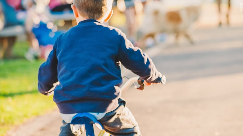 Child riding bike generic