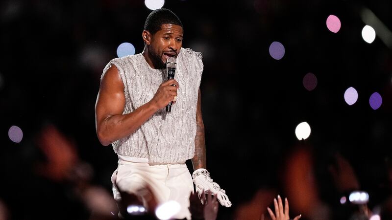 Usher performs during halftime of the NFL Super Bowl 58 football game between the San...