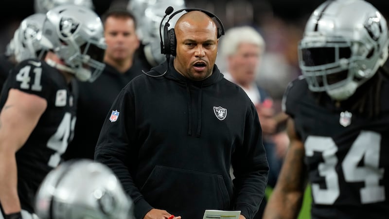 Las Vegas Raiders interim head coach Antonio Pierce walks the sidelines during the first half...