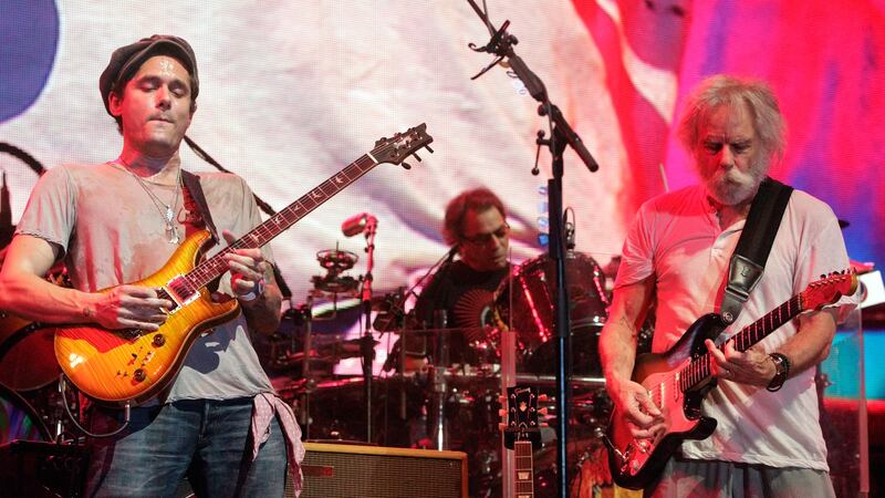 John Mayer, left, performs with Bob Weir, right, of Dead & Co. at the Bonnaroo Music and Arts...