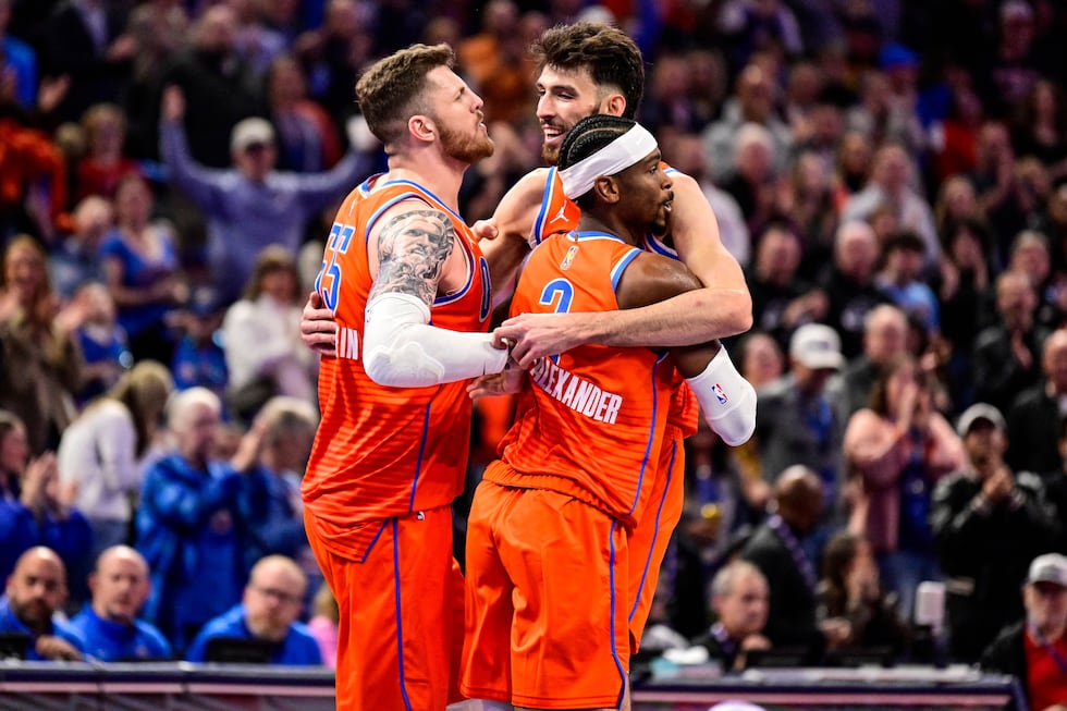 Oklahoma City Thunder center/forward Chet Holmgren (7), center, celebrates with Oklahoma City...