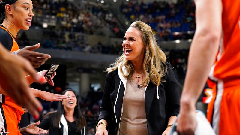 FILE - Team Wilson head coach Becky Hammon talks to players during the first half of a WNBA...