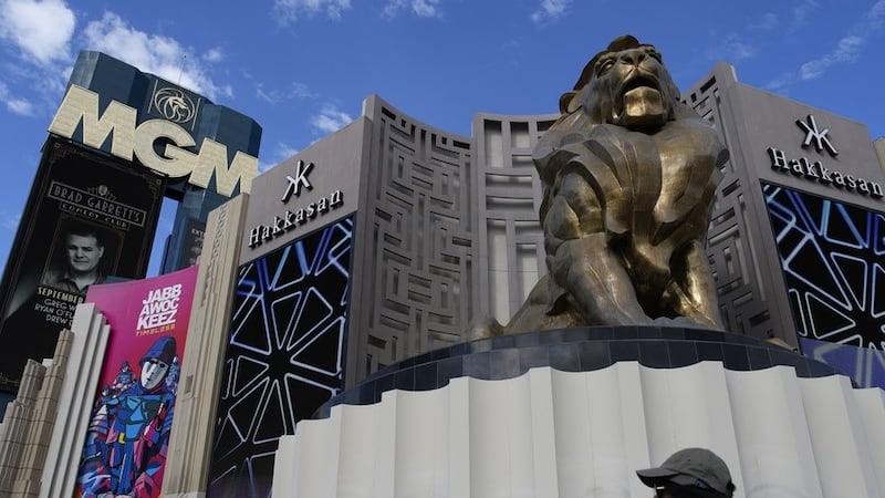 People walk by the MGM Grand hotel-casino Wednesday, Sept. 13, 2023, in Las Vegas.