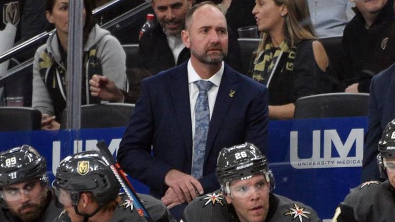 Vegas Golden Knights coach Pete DeBoer looks on from the bench against the Carolina Hurricanes...
