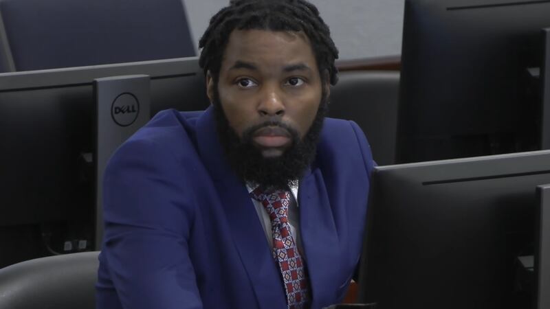 The viral moment caught on courtroom cameras shows Redden leaping “Superman style” across the...