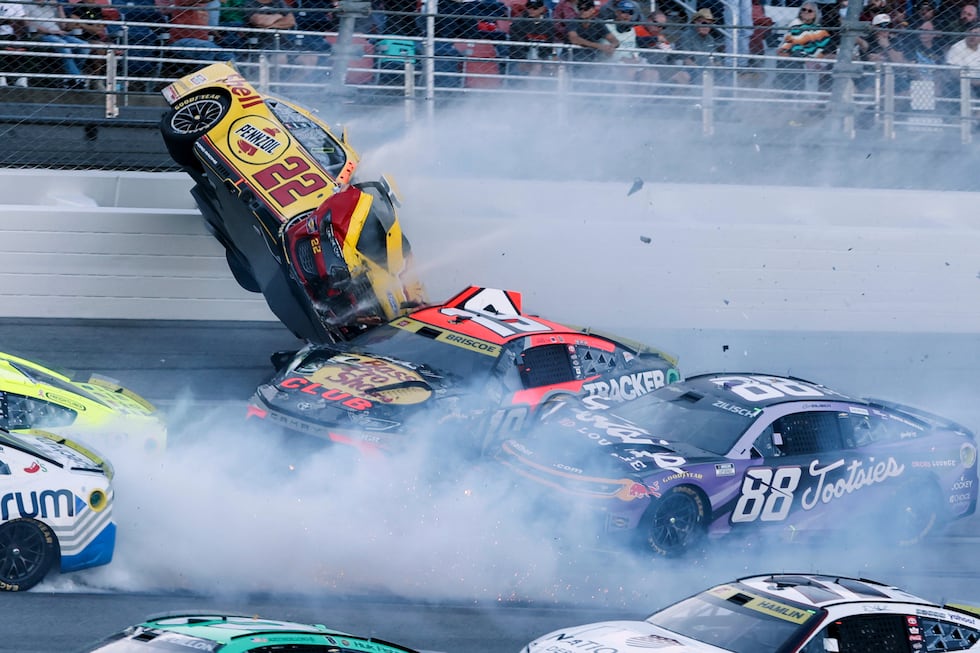 Joey Logano (22) flips after wrecking with Chase Briscoe (19) and involving multiple drivers...