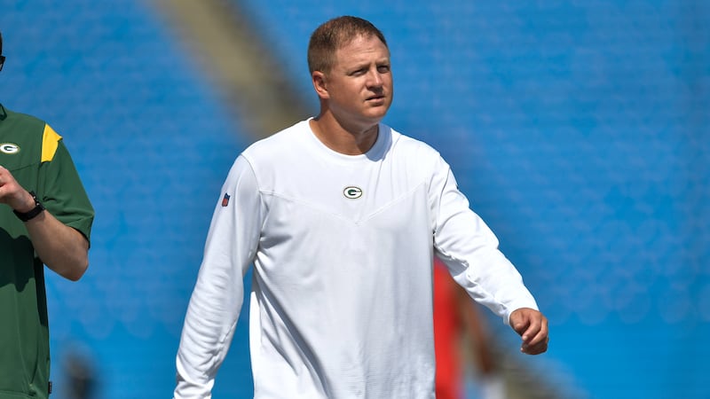 Green Bay Packers quarterbacks/passing game coordinator Luke Getsy walks on the field before a...