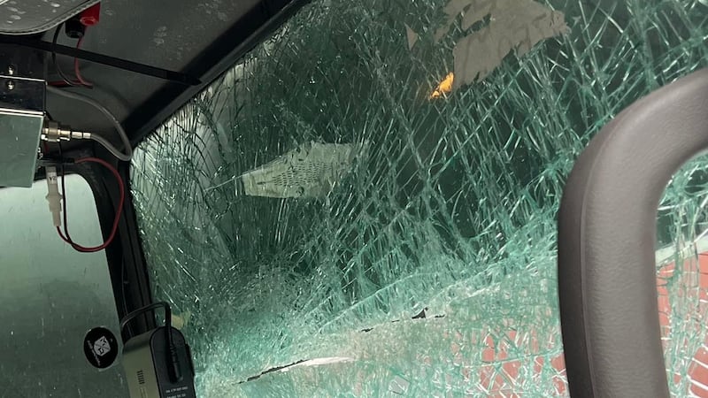 A gallon of milk thrown smashes a passing semi-truck's windshield along K-4 on Oct. 13, 2023.
