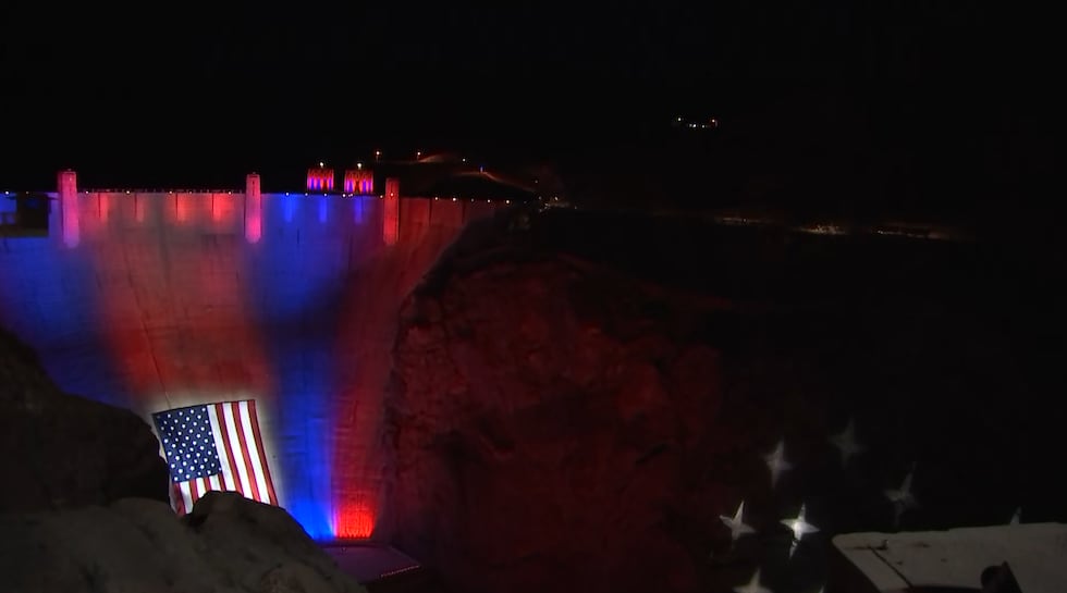 Hoover Dam closed early Thursday night so crews could readjust a massive American flag...