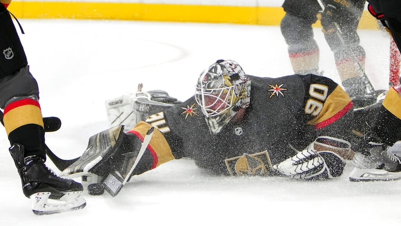 Vegas Golden Knights goaltender Robin Lehner (90) makes a save against the New Jersey Devils...