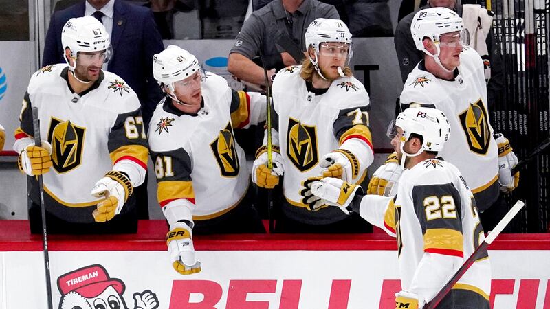Vegas Golden Knights center Michael Amadio (22) celebrates with teammates after scoring a goal...