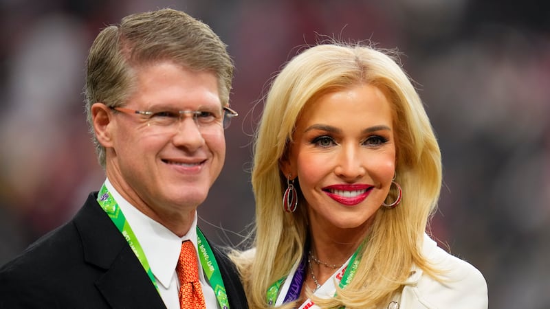 Kansas City Chiefs chairman and CEO Clark Hunt, left, and his wife, Tavia Hunt, stand on the...
