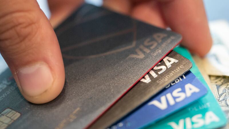 This Aug. 11, 2019 file photo shows Visa credit cards in New Orleans. U.S. consumers reduced...