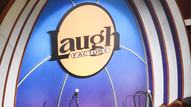 FILE - A crew technician for ServiceMaster by ARS uses a commercial fogger to spray...