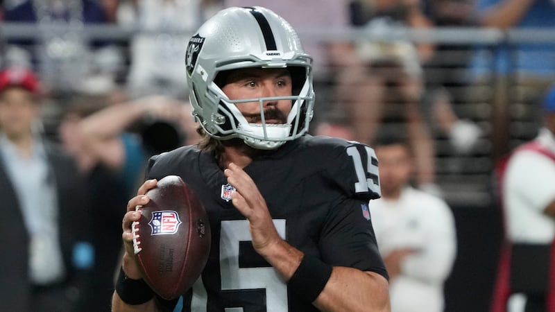 Las Vegas Raiders quarterback Gardner Minshew (15) looks to pass against the Dallas Cowboys...