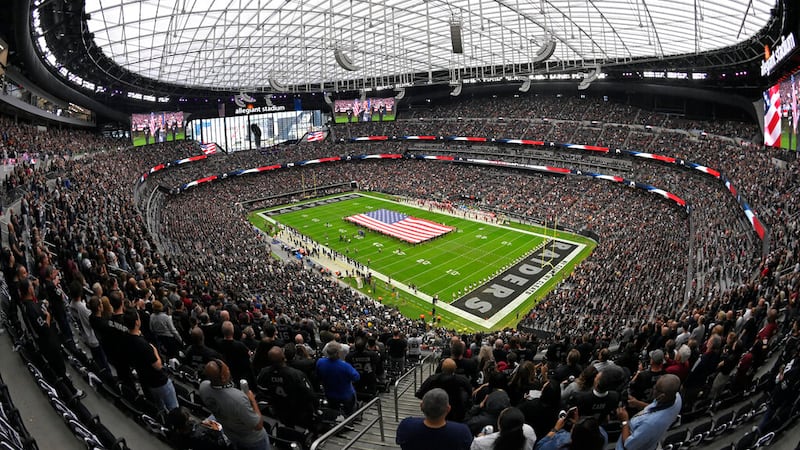 Fans fill Allegiant Stadium before an NFL football game between the Las Vegas Raiders and the...