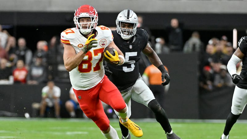 Kansas City Chiefs tight end Travis Kelce (87) runs in front of Las Vegas Raiders linebacker...