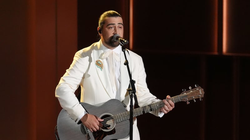 Noah Kahan performs "Bridge Over Troubled Water" during an in memoriam presentation during the...