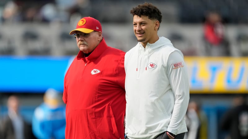 FILE - Kansas City Chiefs quarterback Patrick Mahomes, right, and head coach Andy Reid stand...