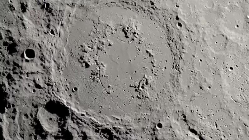 Scientists have discovered that two craters on the moon were created when an asteroid slammed...