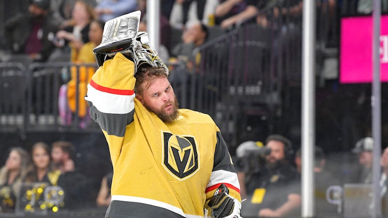 Vegas Golden Knights goaltender Robin Lehner puts his helmet on before the team's NHL game...