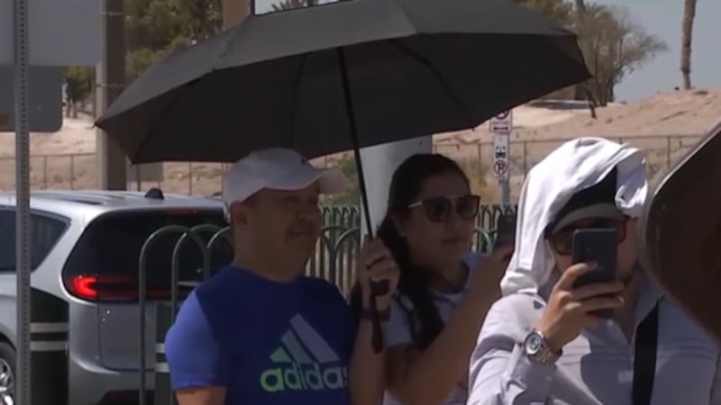 Photo of Las Vegas visitors under extreme heat.